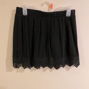 Black skirt with lace detail. Size large.
